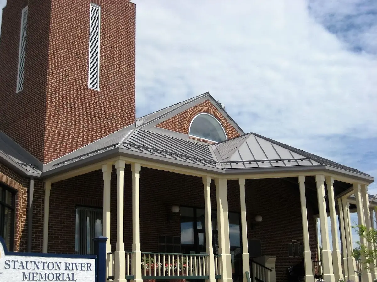 Skilled roofing craftsmen working on a residential roof in Tarboro